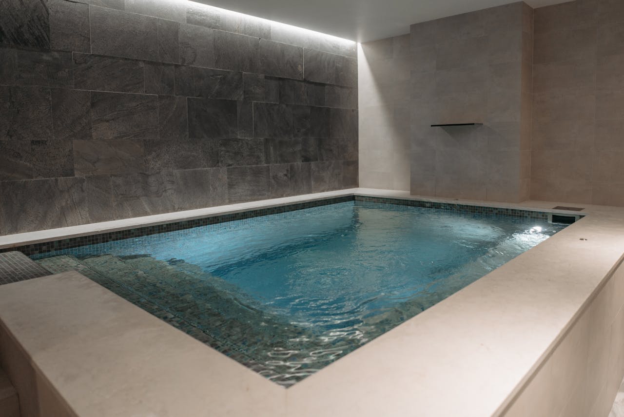 The Art of Drawing Readers In: Your attractive post title goes here 2 Elegant indoor spa pool with modern stone tile interior, perfect for relaxation.